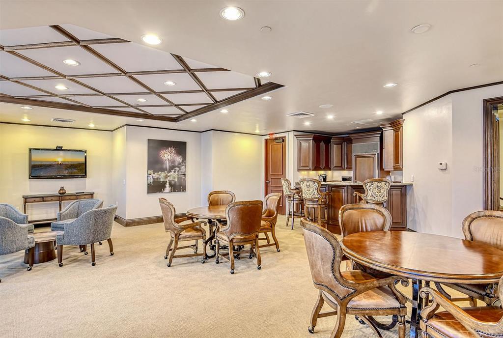 464 Golden Gate Point, Unit 304 Sarasota, FL 34236 - Photo 39 of 60 a view of a dining room with furniture