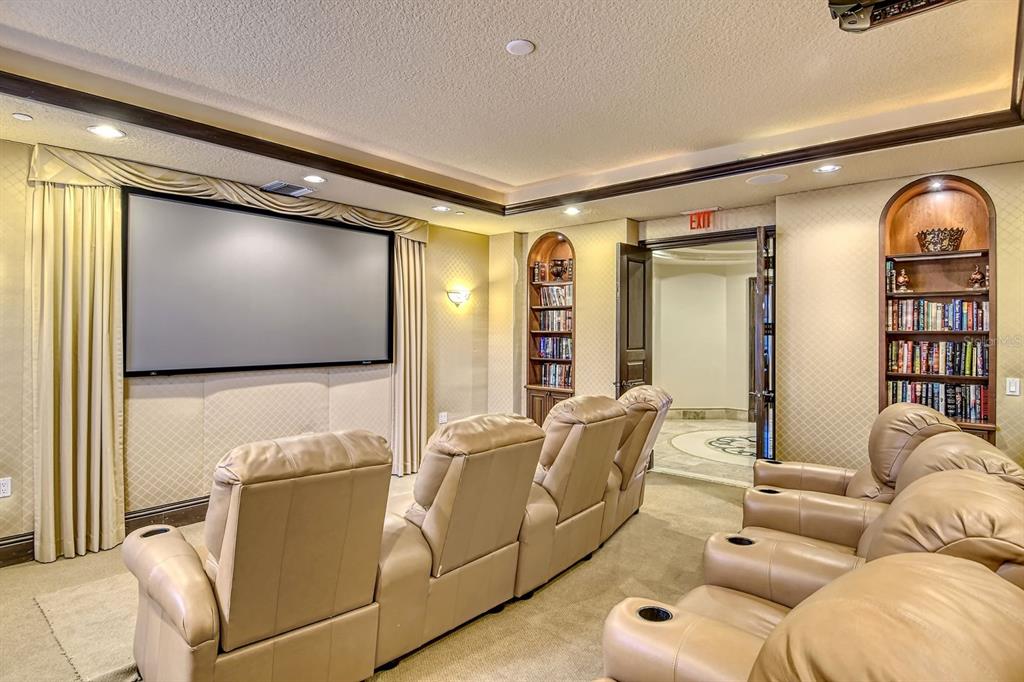 464 Golden Gate Point, Unit 304 Sarasota, FL 34236 - Photo 40 of 60 a living room with furniture and a flat screen tv