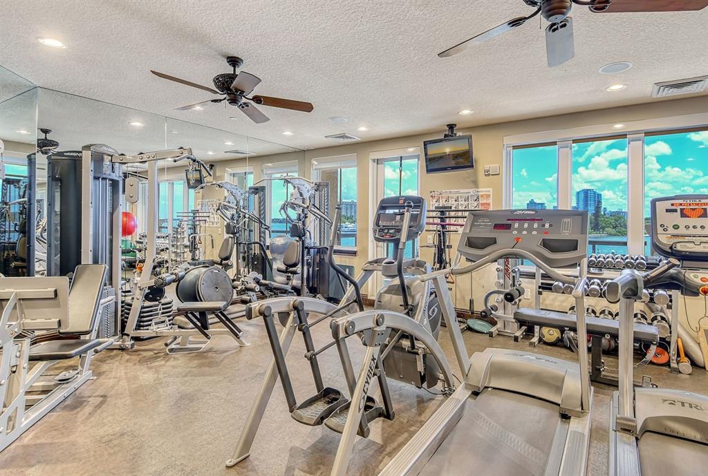 464 Golden Gate Point, Unit 304 Sarasota, FL 34236 - Photo 41 of 60 a view of a room with gym equipment