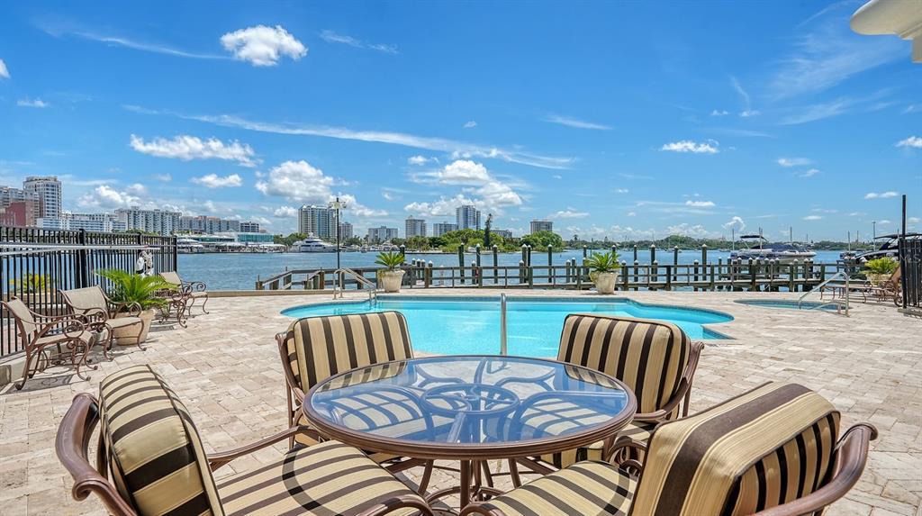 464 Golden Gate Point, Unit 304 Sarasota, FL 34236 - Photo 44 of 60 a view of a swimming pool and patio