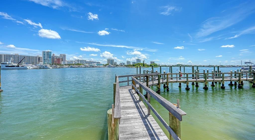 464 Golden Gate Point, Unit 304 Sarasota, FL 34236 - Photo 47 of 60 a view of a swimming pool with outdoor seating