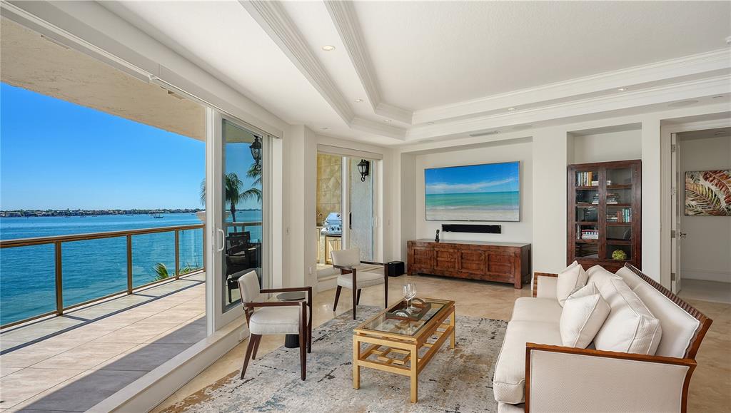 464 Golden Gate Point, Unit 304 Sarasota, FL 34236 - Photo 8 of 60 a living room with furniture and a large window