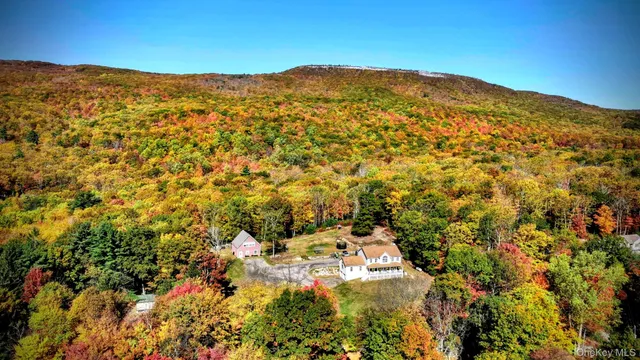 a view of a mountain range in a cloudy sky
