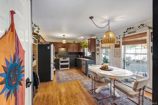 a open kitchen with dining table and chairs