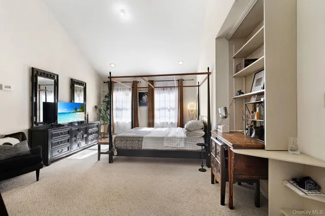 a bedroom with furniture and a window