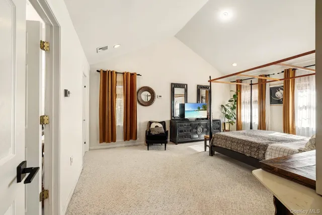 a bedroom with furniture and a window