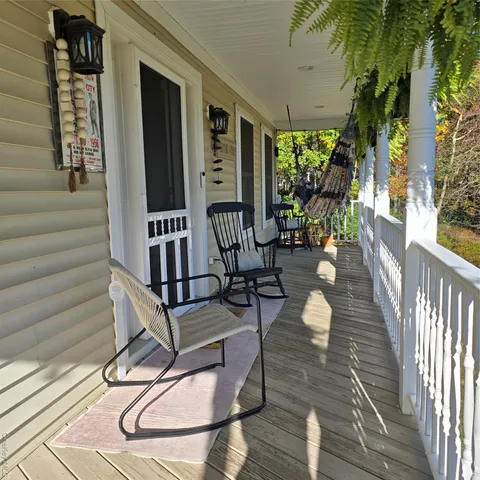 a view of a patio with wooden floor