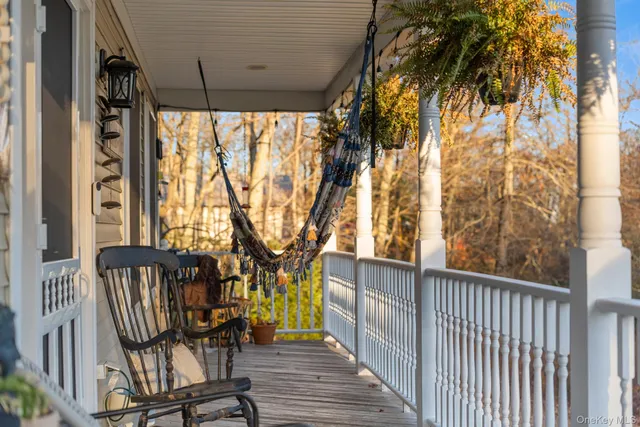 a view of a chairs and table in the balcony