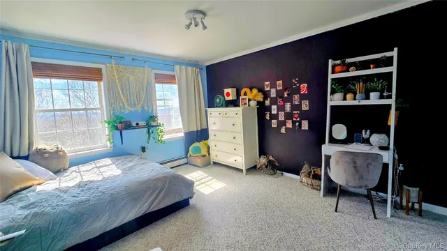 a bedroom with bed and a window