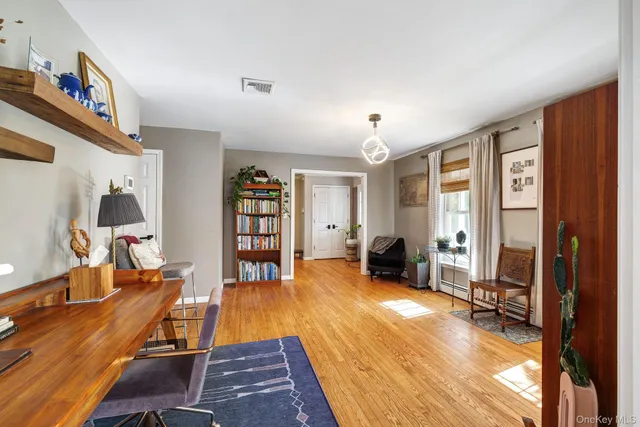 a room with furniture and a wooden floor