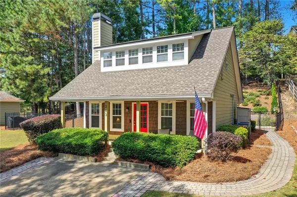 a front view of a house with garden