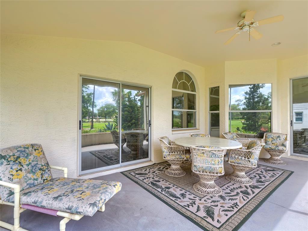 11228 Windrush Circle Hudson, FL 34667 - Photo 36 of 67 a living room with furniture and a rug