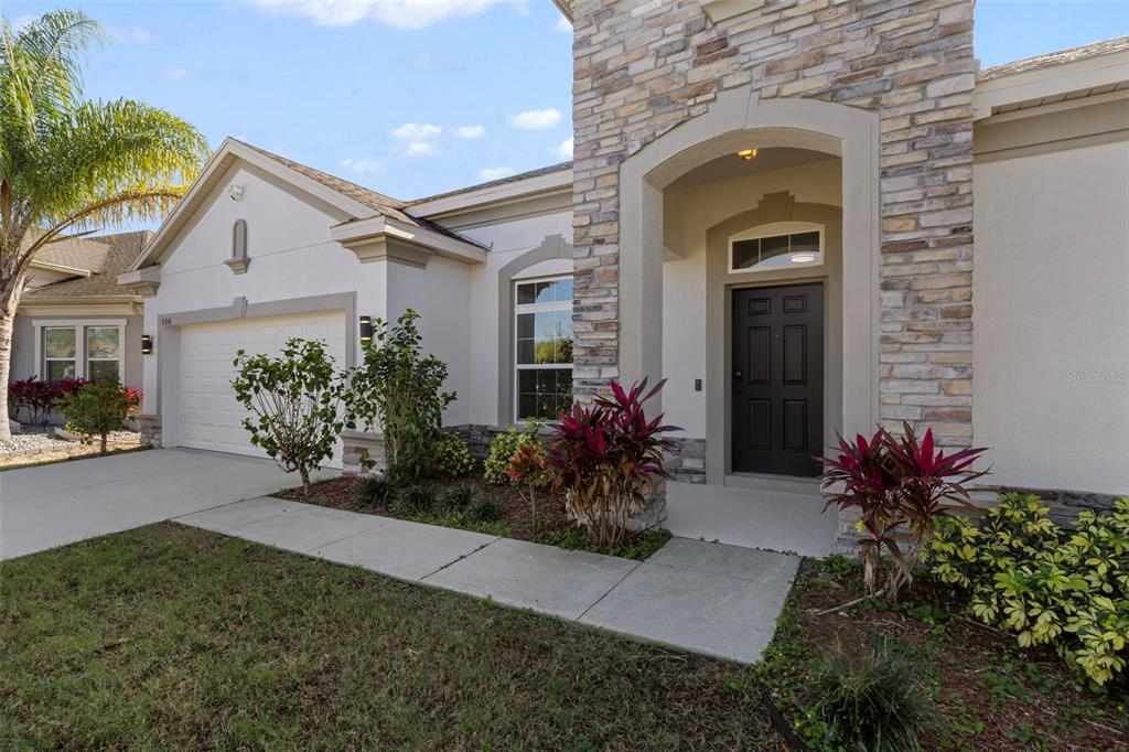 5356 Ragusa Loop St. Cloud, FL 34771 - Photo 14 of 69 front view of a house with a yard
