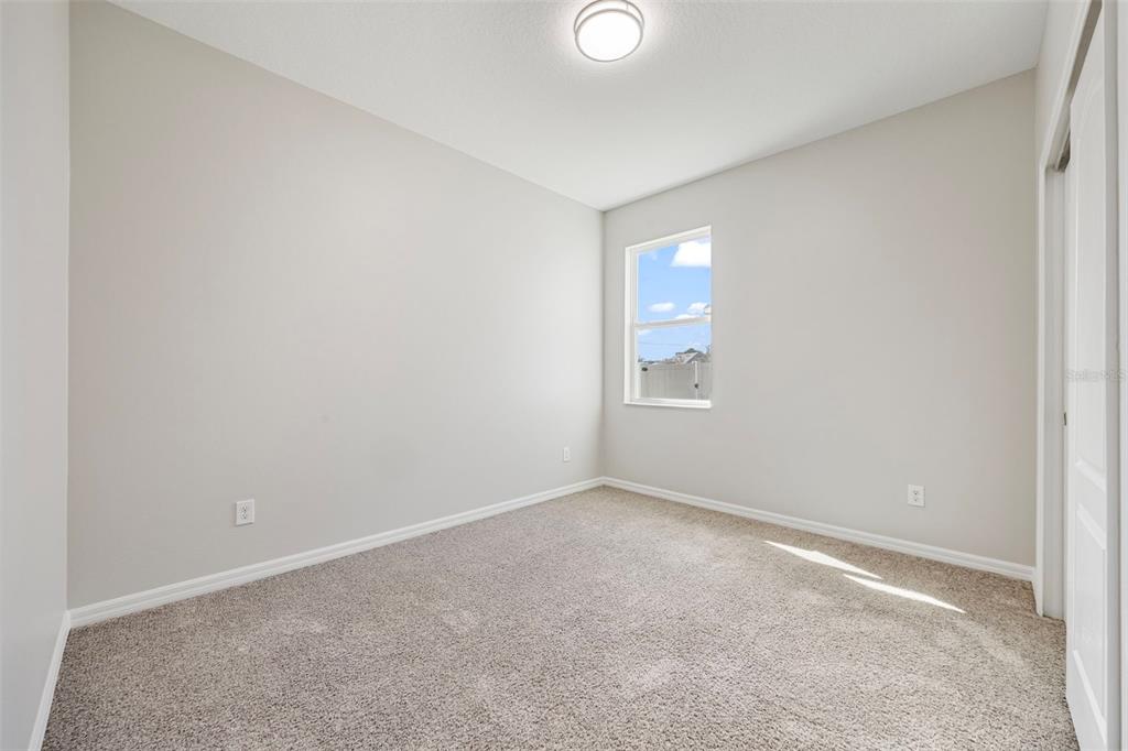 5356 Ragusa Loop St. Cloud, FL 34771 - Photo 21 of 69 an empty room with a window