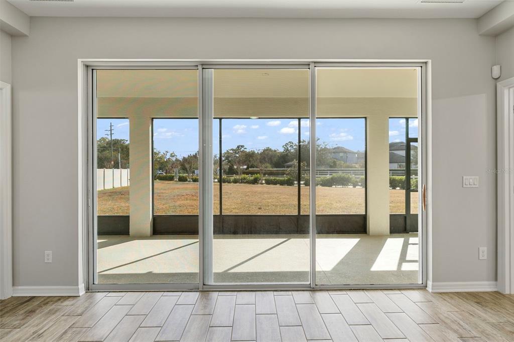 5356 Ragusa Loop St. Cloud, FL 34771 - Photo 48 of 69 a view of a glass door of the house
