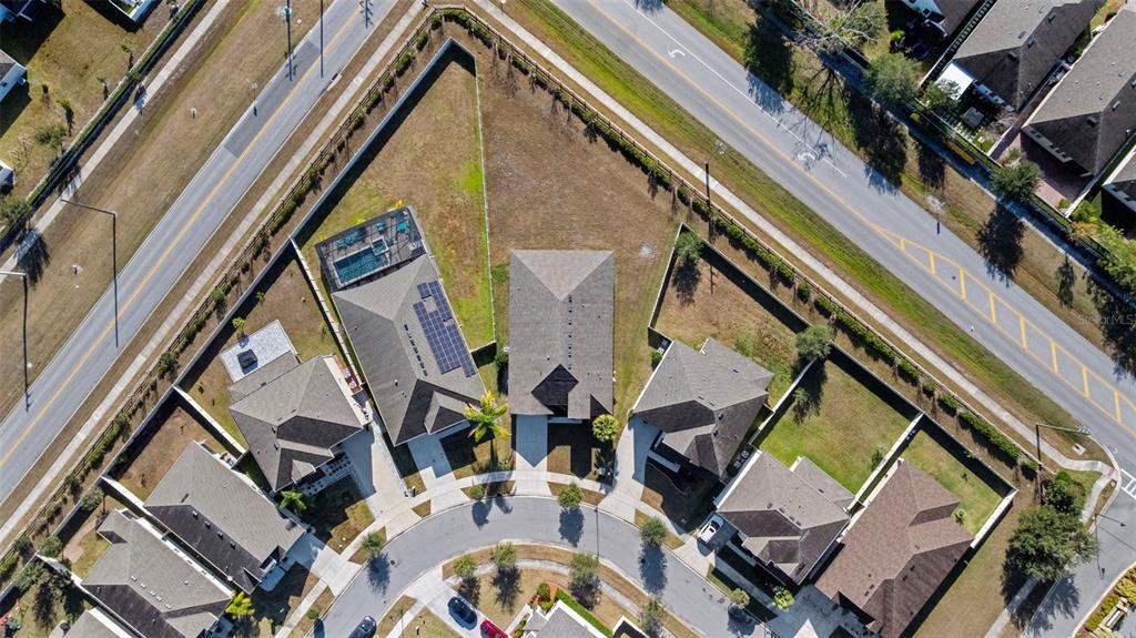 5356 Ragusa Loop St. Cloud, FL 34771 - Photo 56 of 69 a aerial view of a residential apartment building with a yard