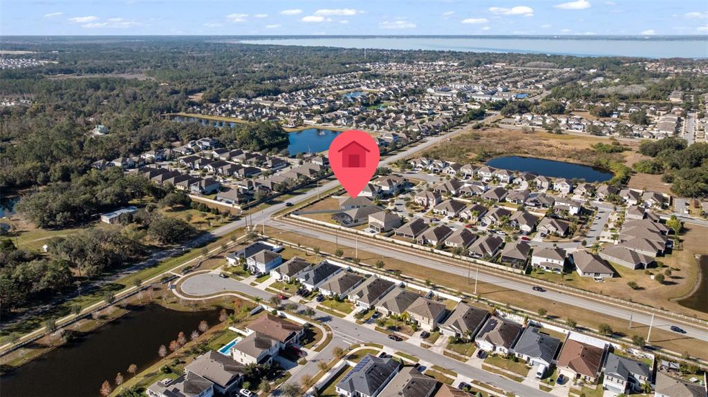 5356 Ragusa Loop St. Cloud, FL 34771 - Photo 60 of 69 an aerial view of a residential houses and city view