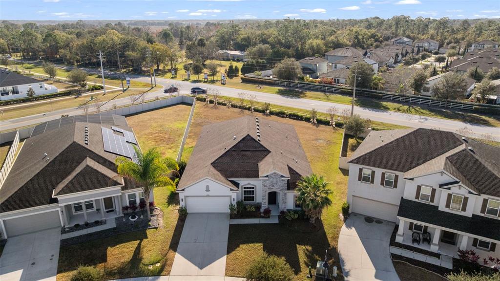 5356 Ragusa Loop St. Cloud, FL 34771 - Photo 61 of 69 an aerial view of a house with a swimming pool and mountains