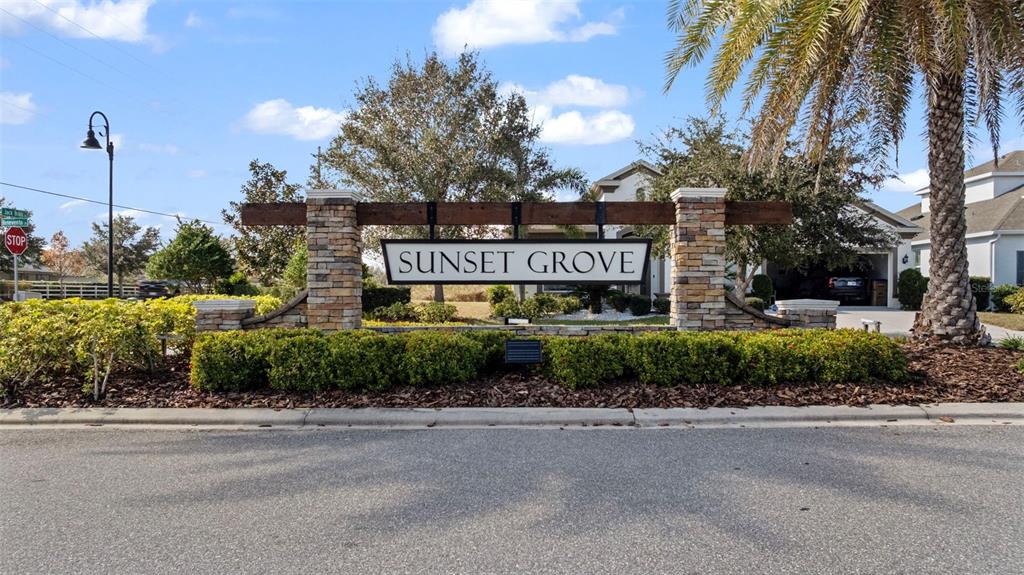 5356 Ragusa Loop St. Cloud, FL 34771 - Photo 8 of 69 a sign that is on a street next to a road