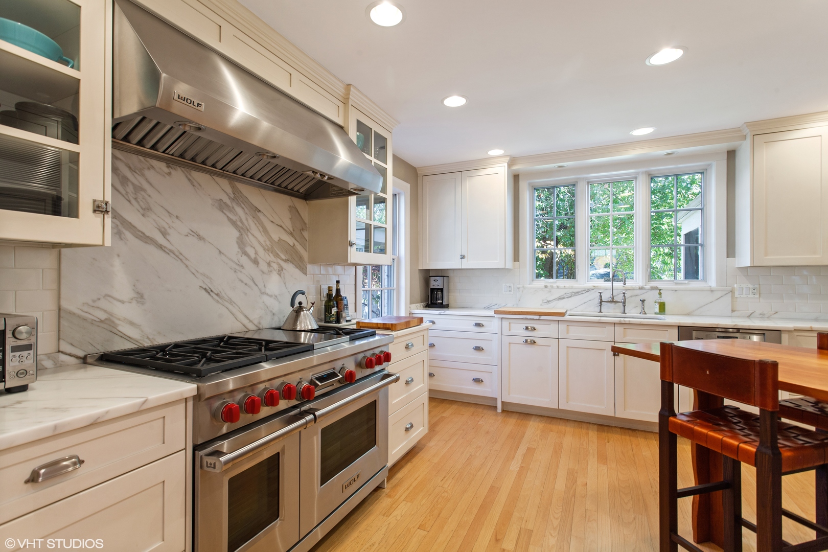 733 Juniper Road Glenview, IL 60025 - Photo 4 of 12 a kitchen with a stove a sink and a microwave