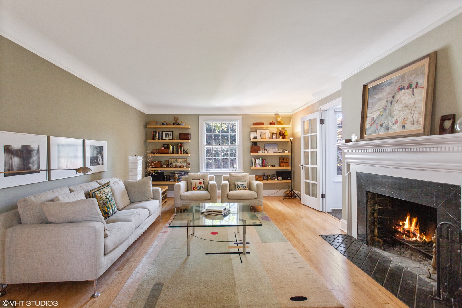 733 Juniper Road Glenview, IL 60025 - Photo 8 of 12 a living room with furniture large window and a fireplace