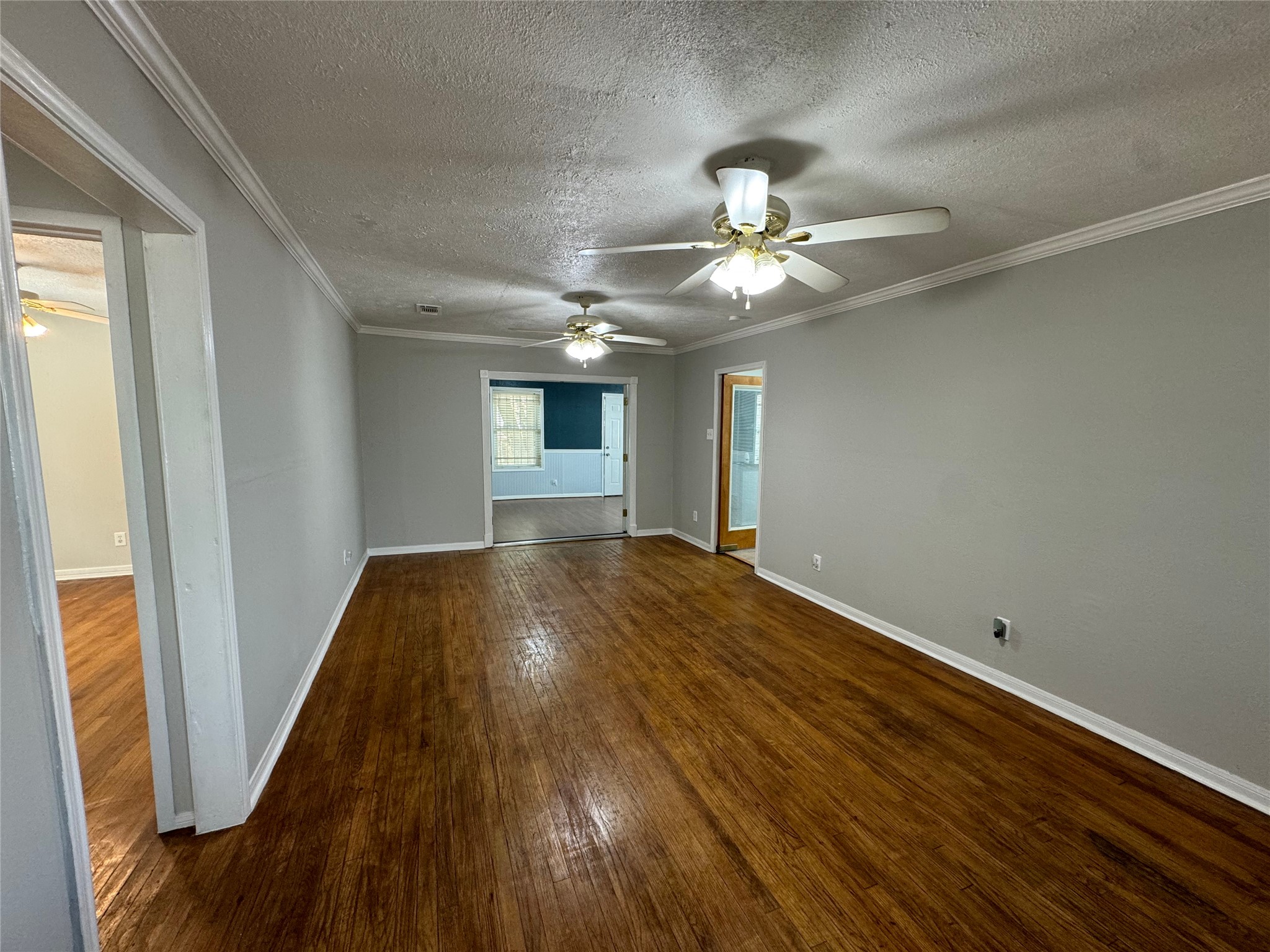 125 Pomeroy Street Pasadena, TX 77506 - Photo 6 of 19 a view of empty room with wooden floor and fan