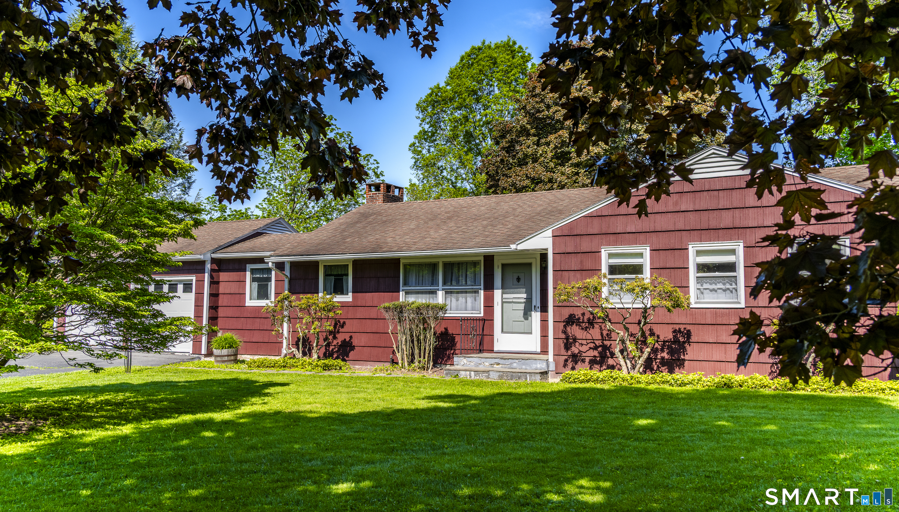 39 Indian Mountain Road Salisbury, CT 06039 - Photo 2 of 16 a front view of a house with a garden