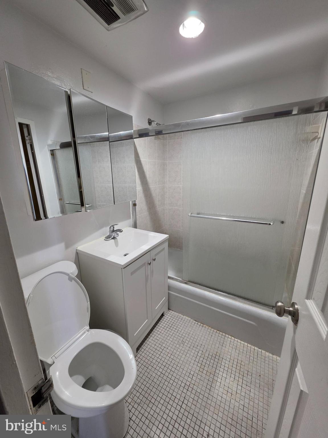 4600 Duke Street, Unit 507 Alexandria, VA 22304 - Photo 11 of 16 a bathroom with a sink toilet and shower