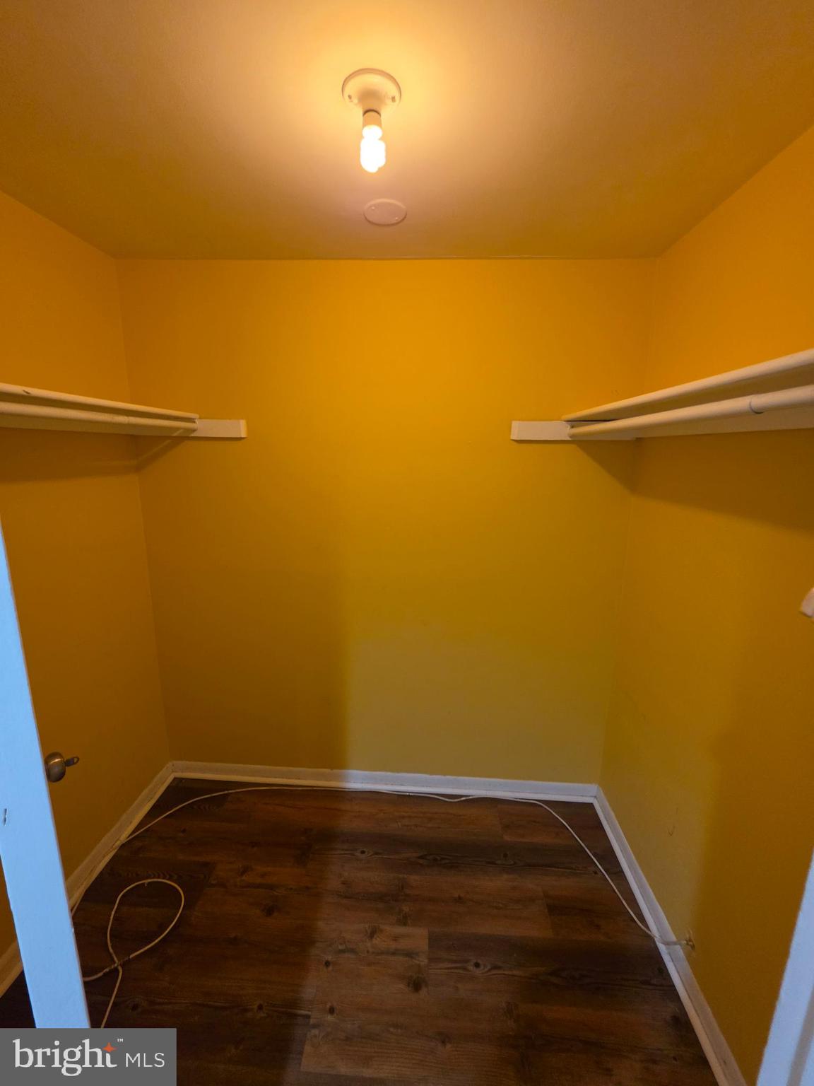 4600 Duke Street, Unit 507 Alexandria, VA 22304 - Photo 12 of 16 a view of a room with wooden floor and fan
