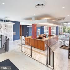 4600 Duke Street, Unit 507 Alexandria, VA 22304 - Photo 2 of 16 a view of a living room and kitchen with furniture and a kitchen view