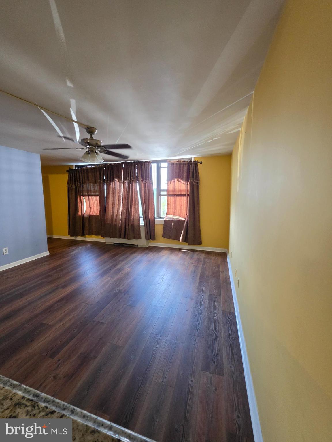 4600 Duke Street, Unit 507 Alexandria, VA 22304 - Photo 9 of 16 wooden floor in an empty room with a window