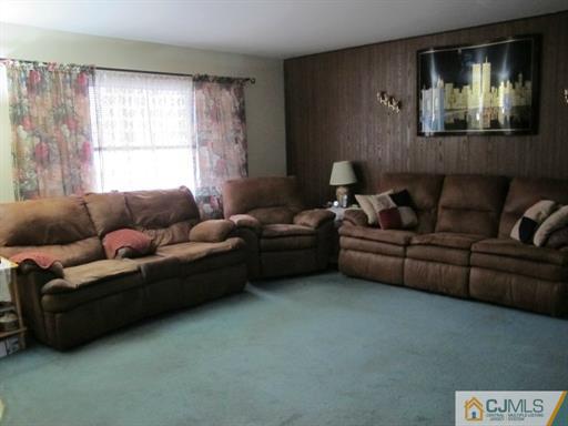 770 Magnolia Road North Brunswick, NJ 08902 - Photo 2 of 25 a living room with furniture and a window