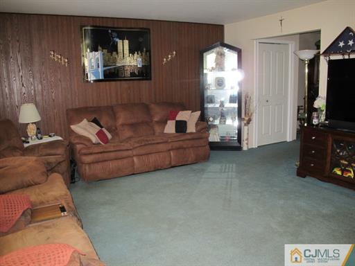 770 Magnolia Road North Brunswick, NJ 08902 - Photo 3 of 25 a living room with furniture and a flat screen tv