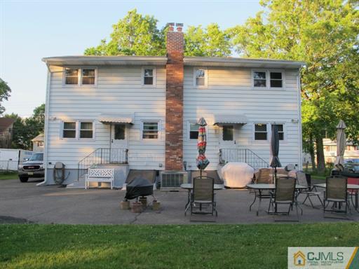 770 Magnolia Road North Brunswick, NJ 08902 - Photo 22 of 25 a front view of house with a garden and patio