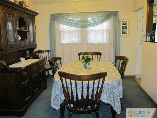 770 Magnolia Road North Brunswick, NJ 08902 - Photo 4 of 25 a dining room with furniture and window