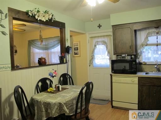 770 Magnolia Road North Brunswick, NJ 08902 - Photo 7 of 25 a kitchen with a table and chairs