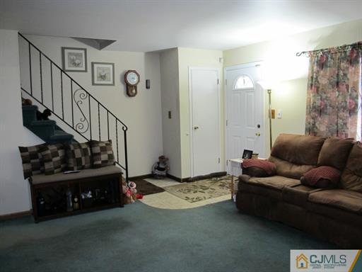 770 Magnolia Road North Brunswick, NJ 08902 - Photo 9 of 25 a living room with furniture and a rug