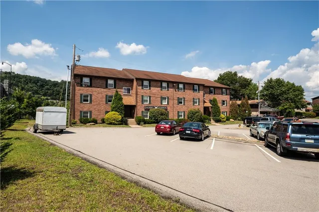 a view of a cars park in front of house