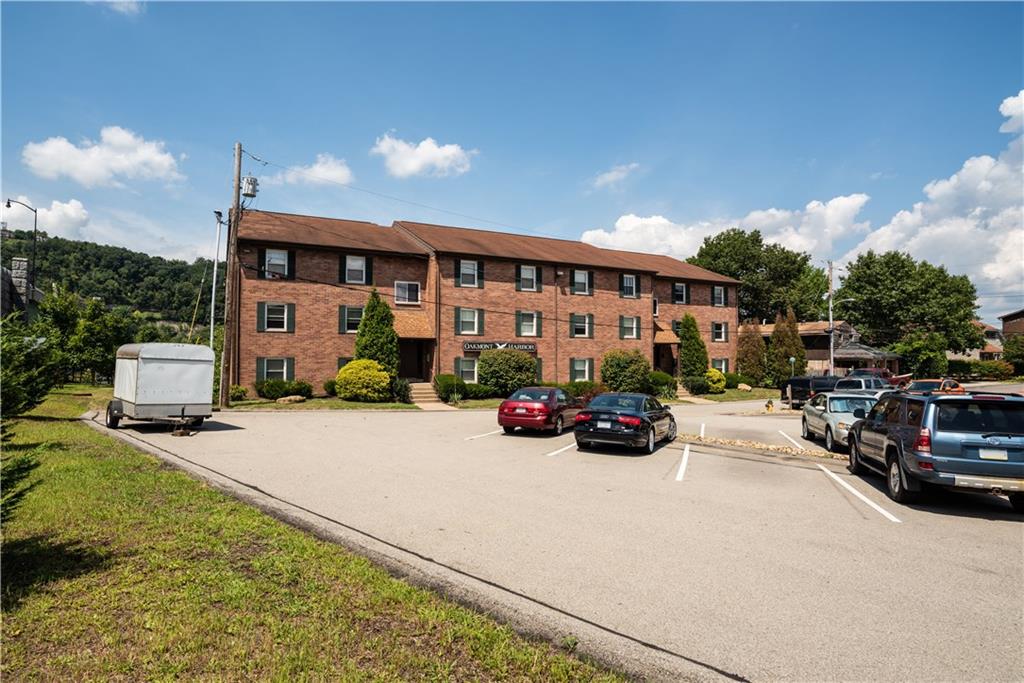 41 Huston Road, Unit 41 Oakmont, PA 15139 - Photo 12 of 15 a view of a cars park in front of house