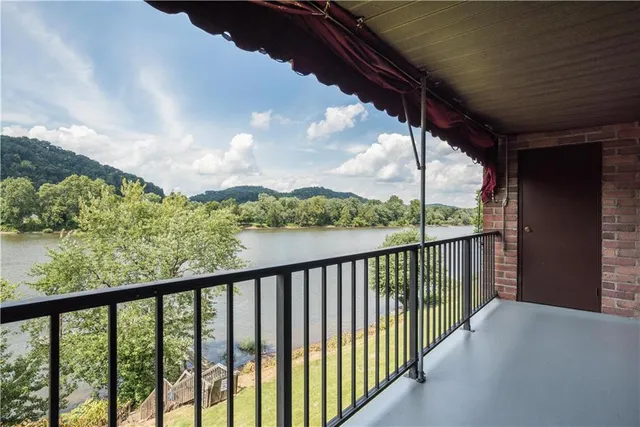 a view of balcony with furniture