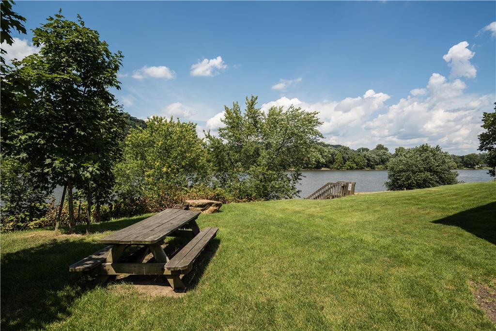 41 Huston Road, Unit 41 Oakmont, PA 15139 - Photo 14 of 15 a backyard of a house with table and chairs