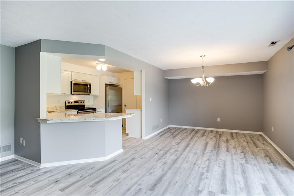41 Huston Road, Unit 41 Oakmont, PA 15139 - Photo 2 of 15 a view of a kitchen with wooden floor and a sink