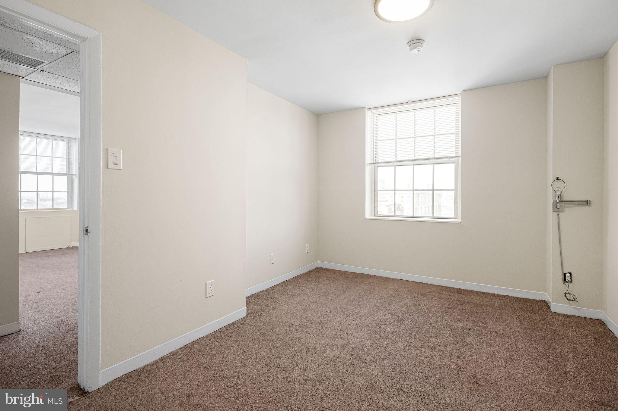 2135 Walnut Street, Unit 1103 Philadelphia, PA 19103 - Photo 12 of 18 an empty room with windows