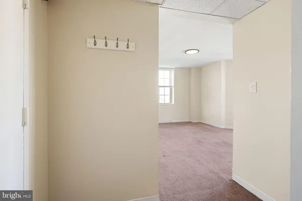 a view of an empty room with a window
