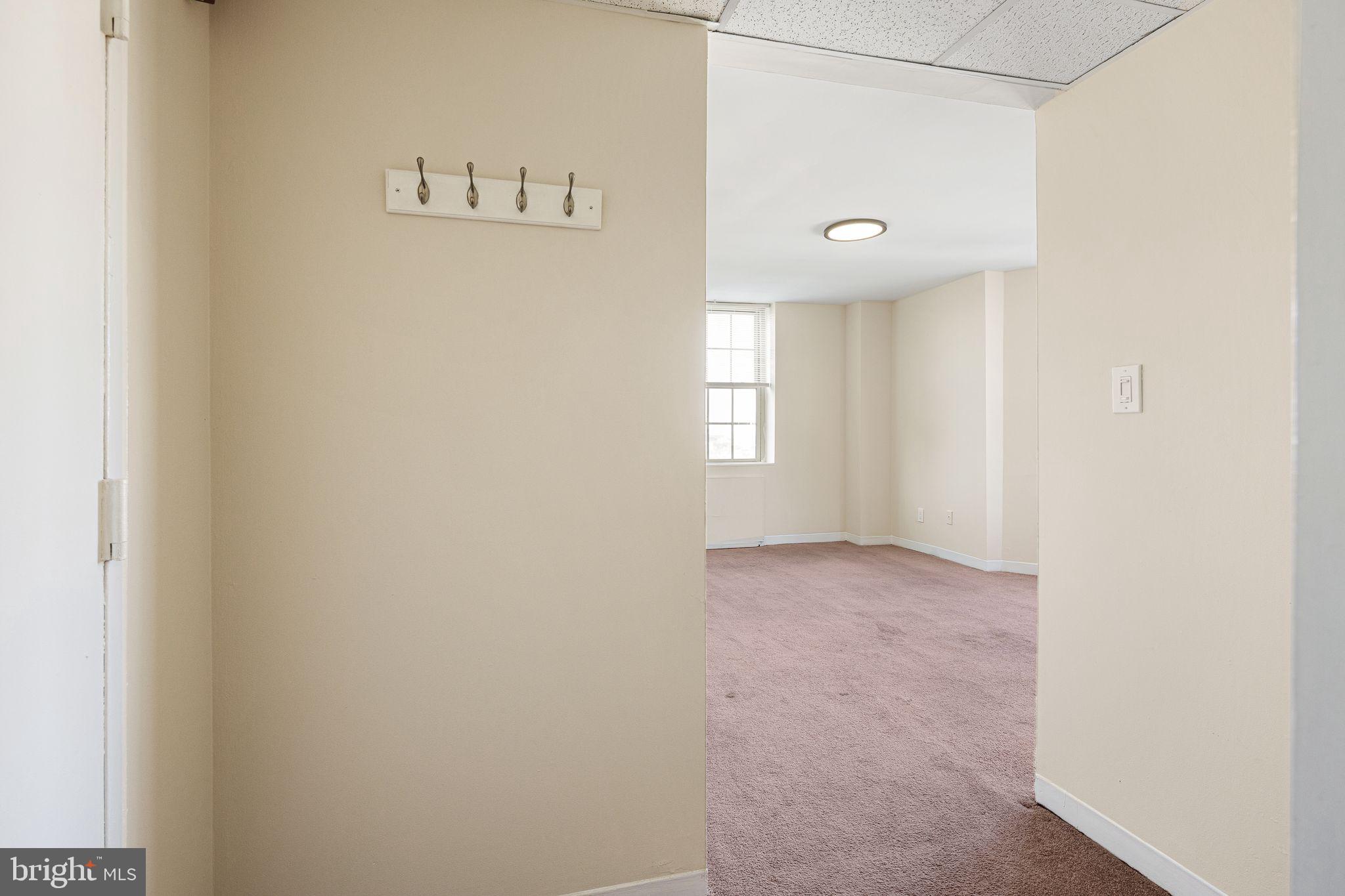 2135 Walnut Street, Unit 1103 Philadelphia, PA 19103 - Photo 4 of 18 a view of an empty room with a window