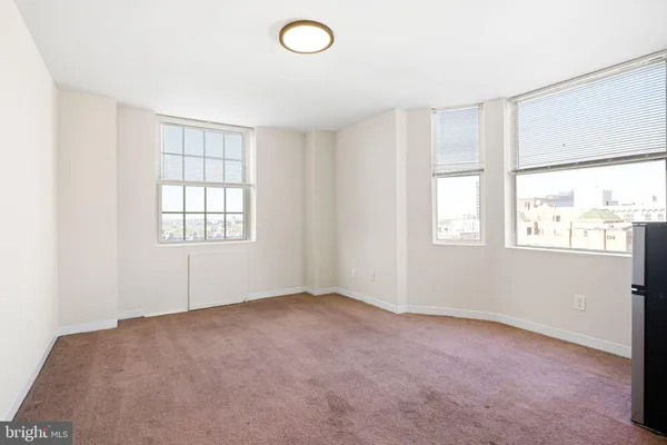 an empty room with windows