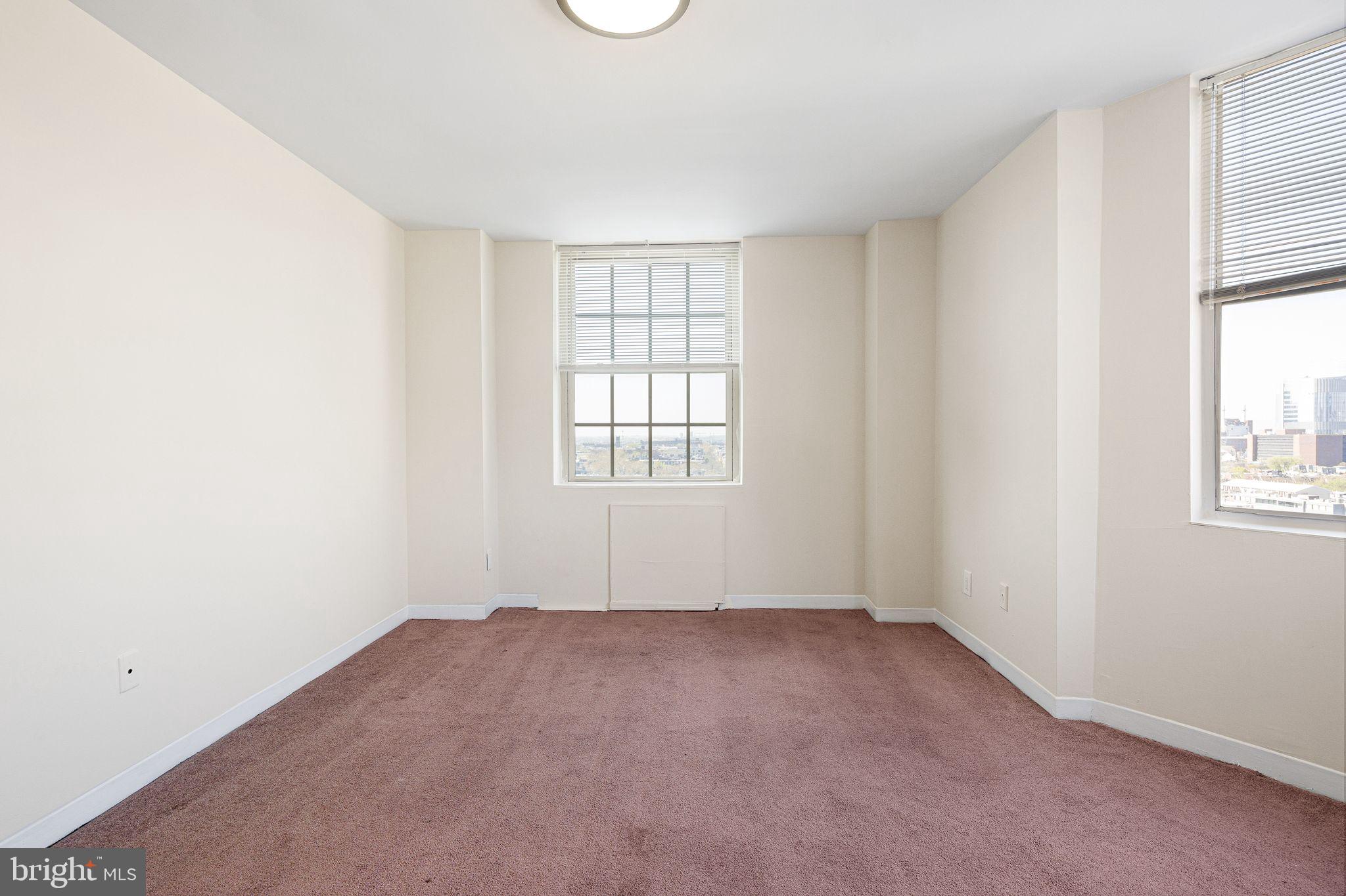 2135 Walnut Street, Unit 1103 Philadelphia, PA 19103 - Photo 6 of 18 an empty room with windows