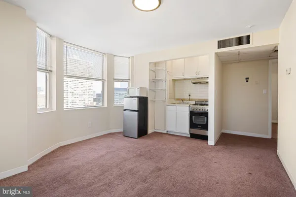 a view of a kitchen with a sink and dishwasher windows