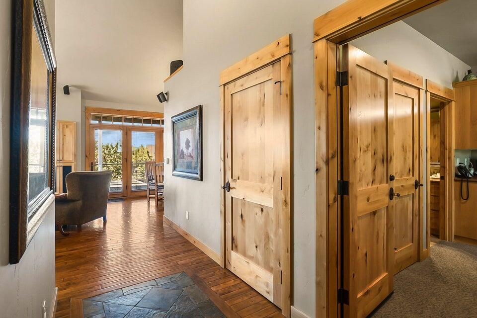 16845 South W Brasada Ranch Road, Unit 23 Powell Butte, OR 97753 - Photo 8 of 47 a view of a hallway with wooden floor and windows