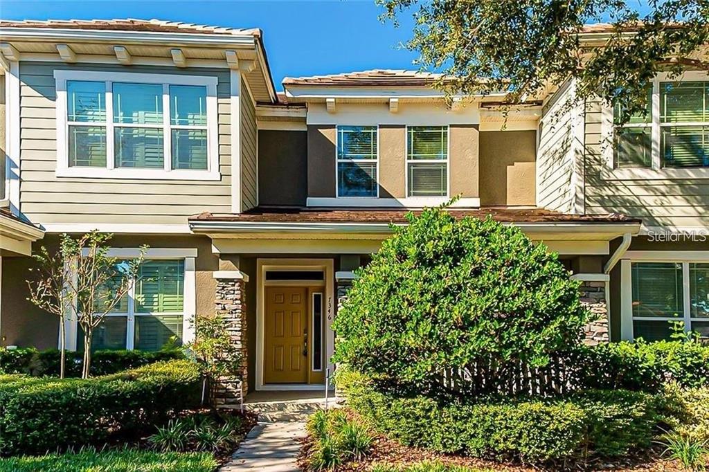 front view of a house with a garden